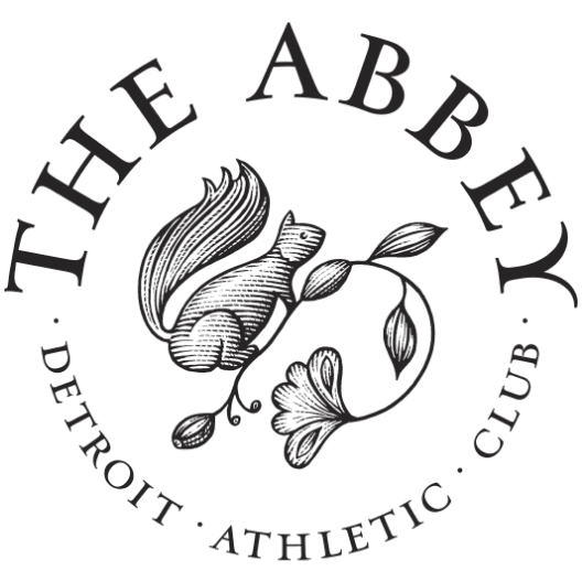 The Abbey brandmark with a squirrel emblem in the center with the wordmark around in a circle