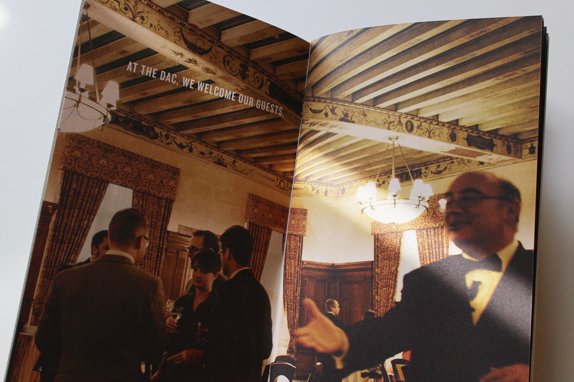 A spread from the brand book - 'At DAC, we welcome our guests.'