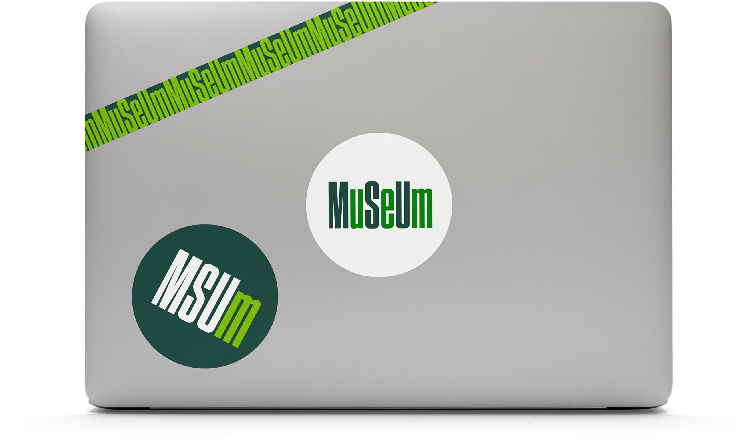 MSU Museum logo branded stickers on a opened laptop cover